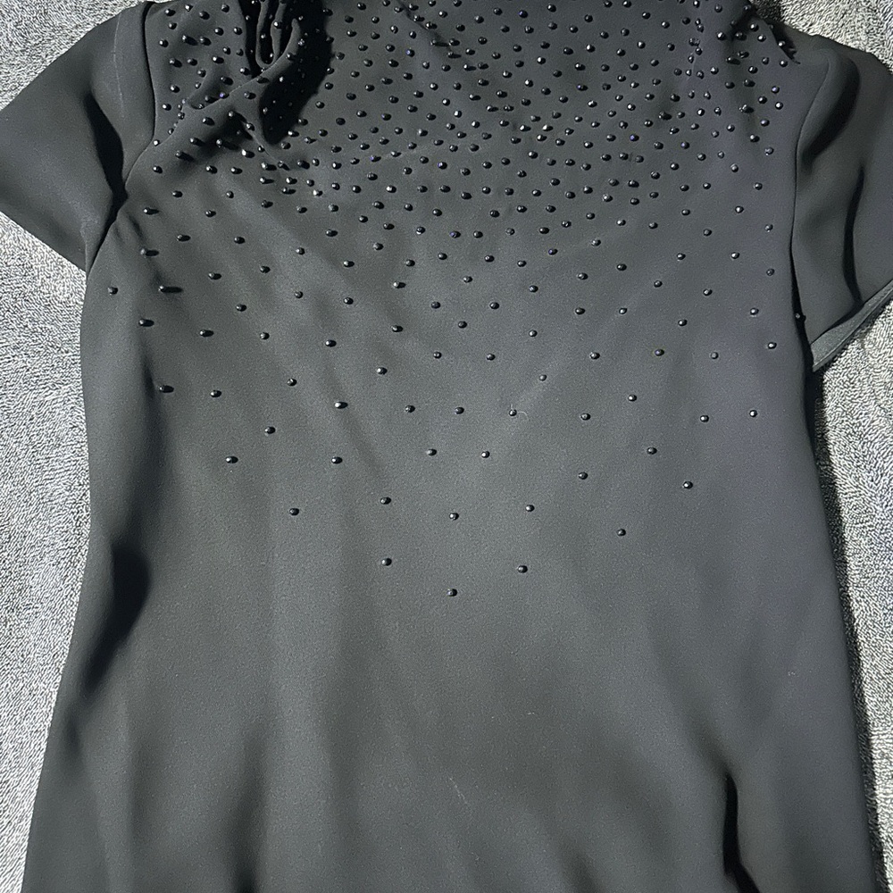 S.L. Fashion Beaded Top with Shoulder Pads.